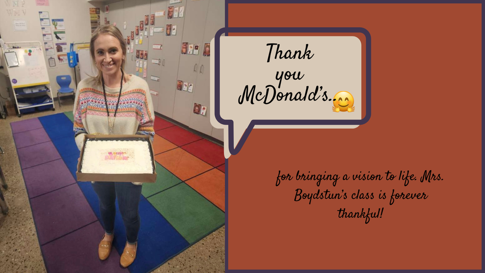 Teacher holding a birthday cake. Thank you McDonald's for bringing a vision to life.