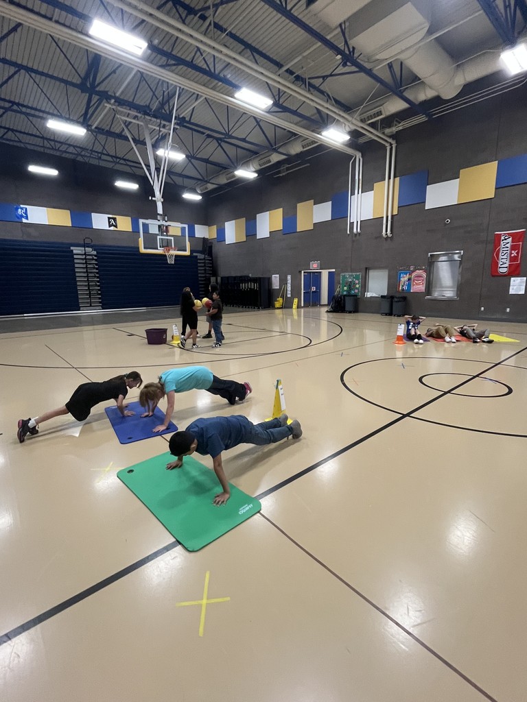 Students practicing push ups.