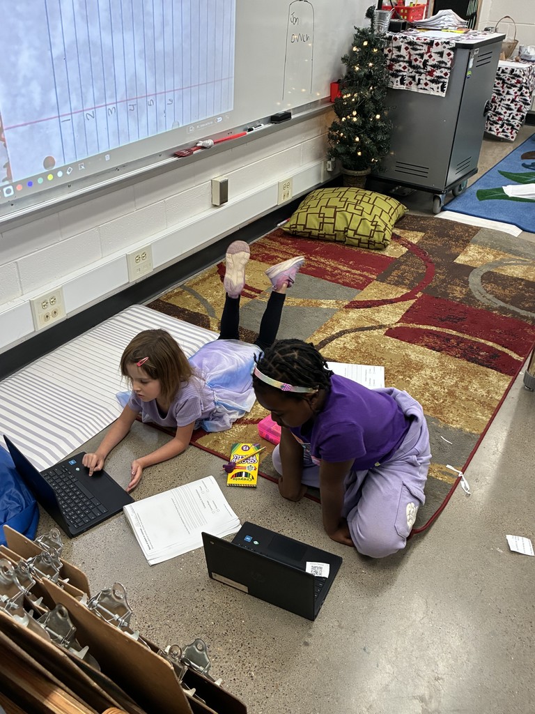 Vaylis and Genesis doing research