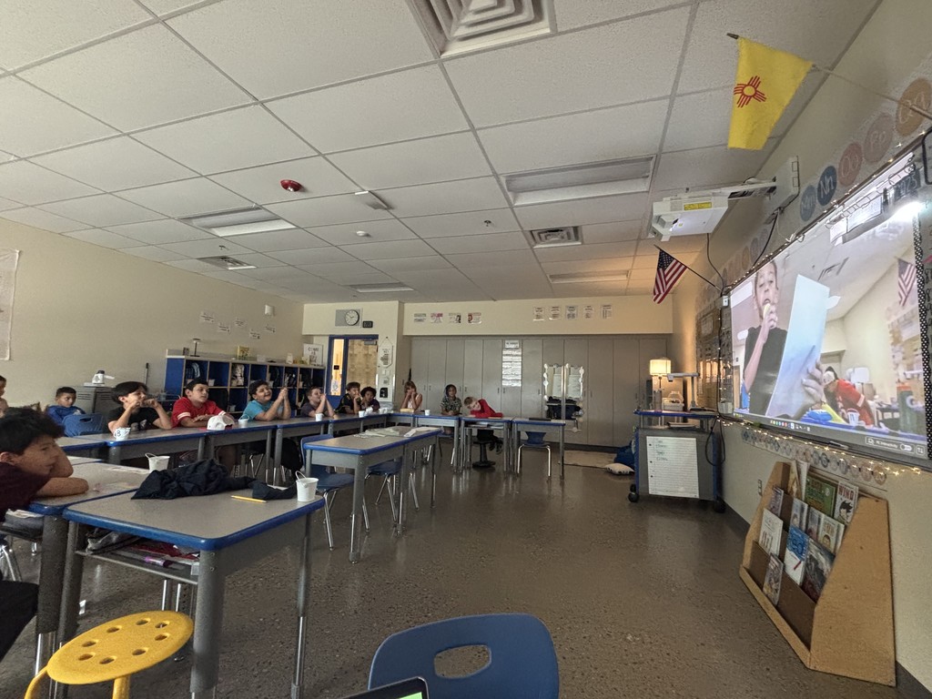 Students watching another student predict the weather