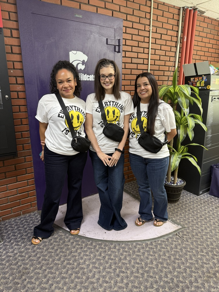 Twinning teachers wearing matching white outfits