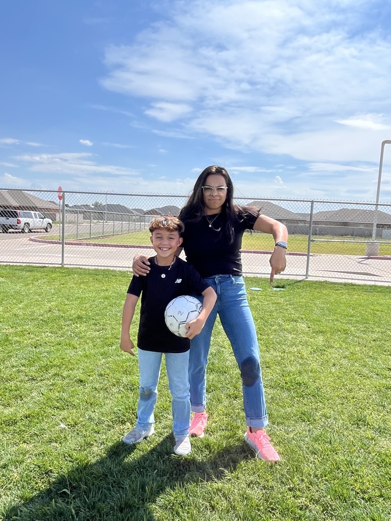 Mrs. Rojas pointing to her wet knee