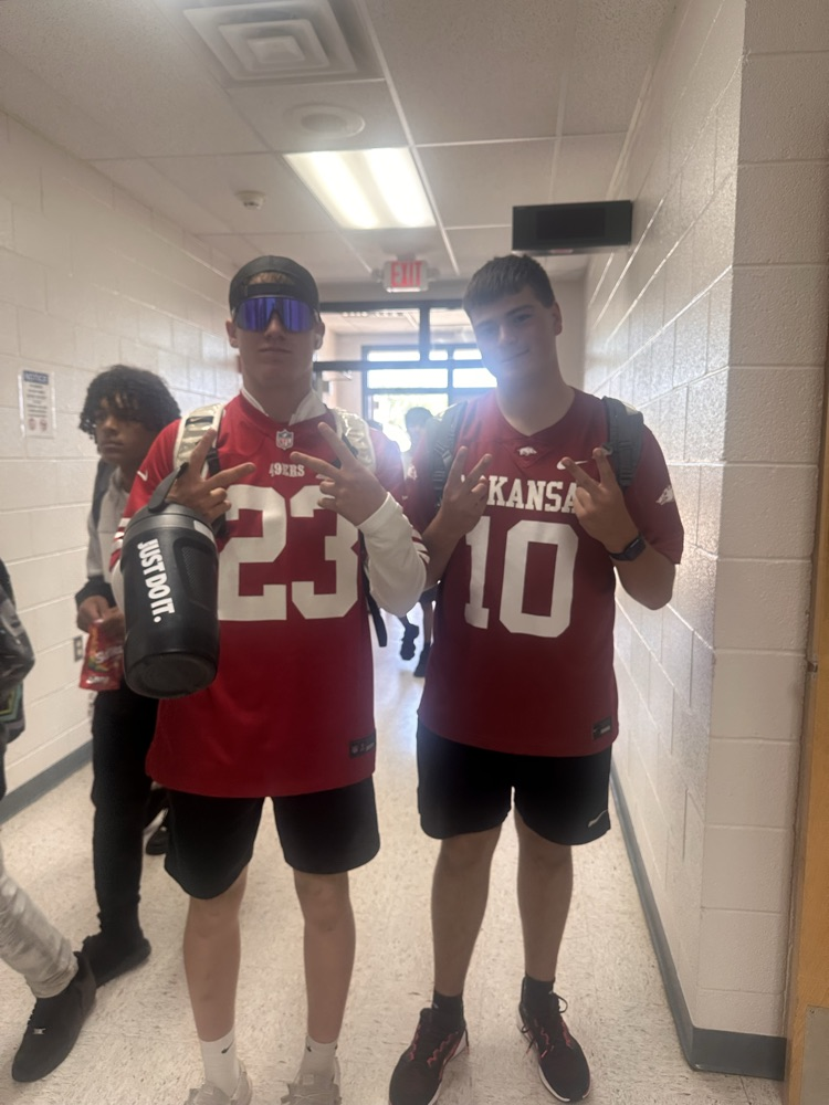 Two students wearing Kansas jerseys