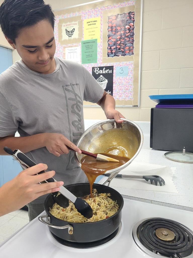 pouring sauce into a pan