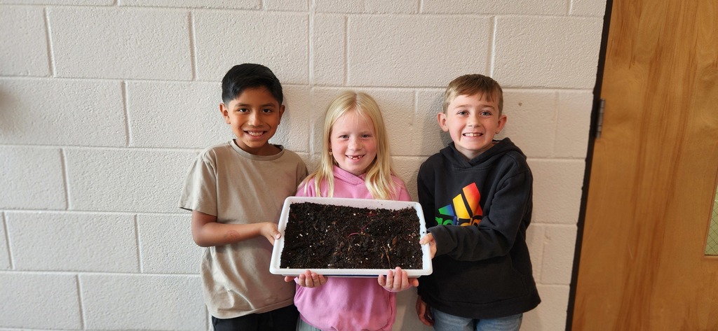 Edison, Brynlee, and Travis with their garden