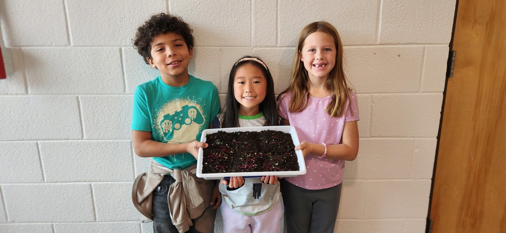 Xander, Leah, and Harper with their garden