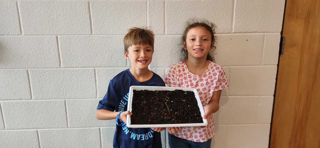 Landon, and Megan with their garden