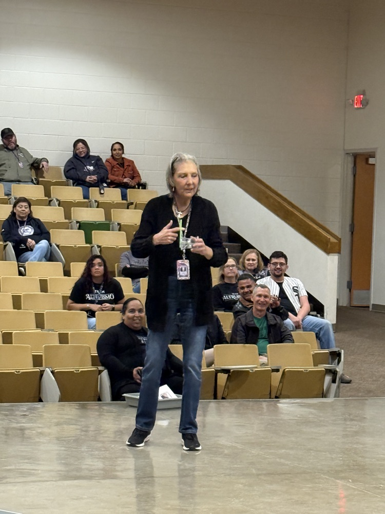 Teacher speaking to a group of teachers