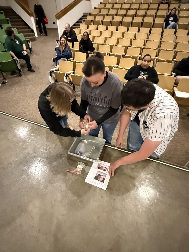 Three teachers working on a project