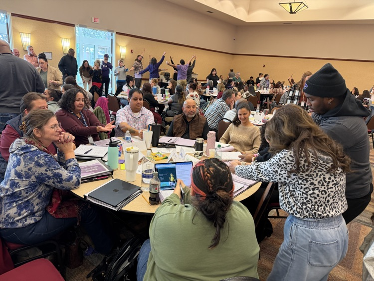 Teachers attending a workshop working on a group project