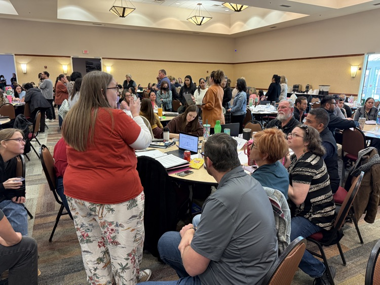 A group of high school teachers learning