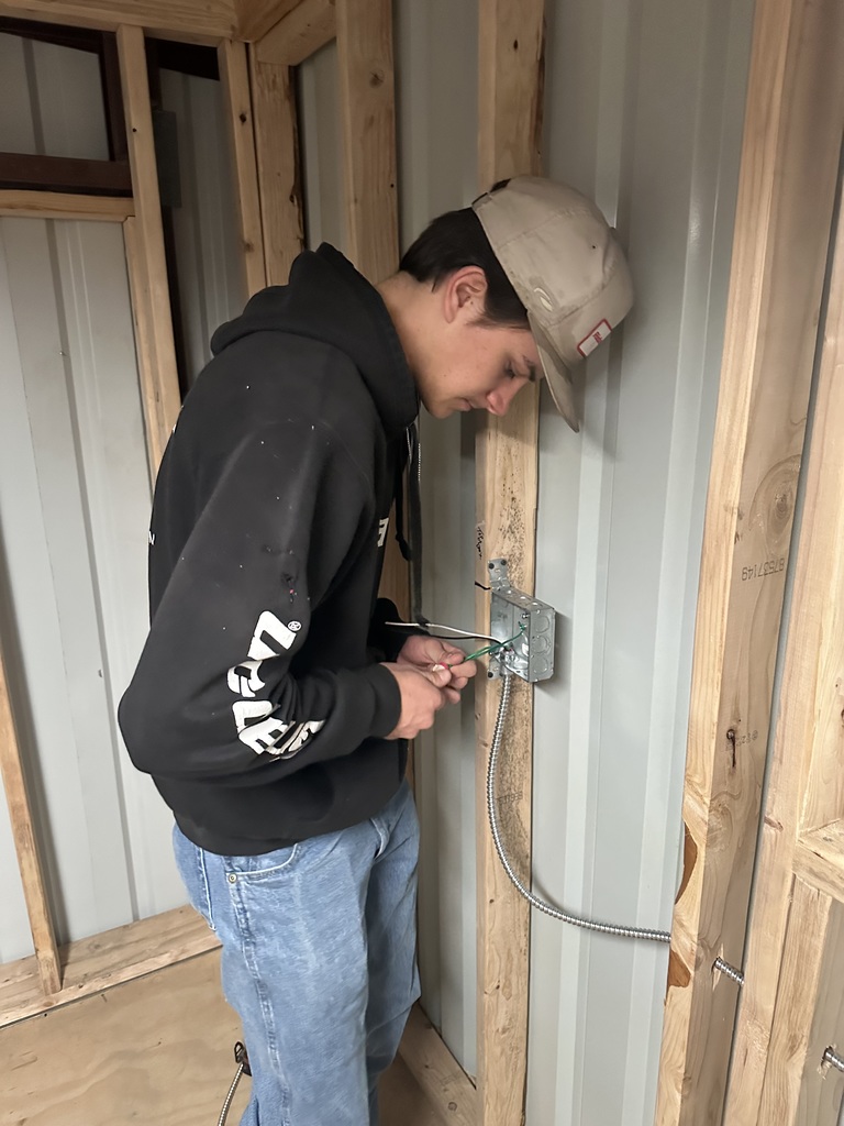 Students working on electrical wiring