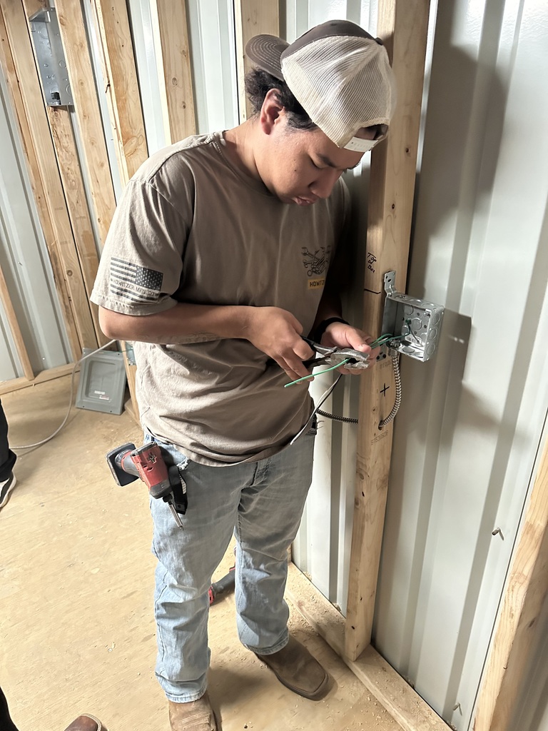 Students working on electrical wiring