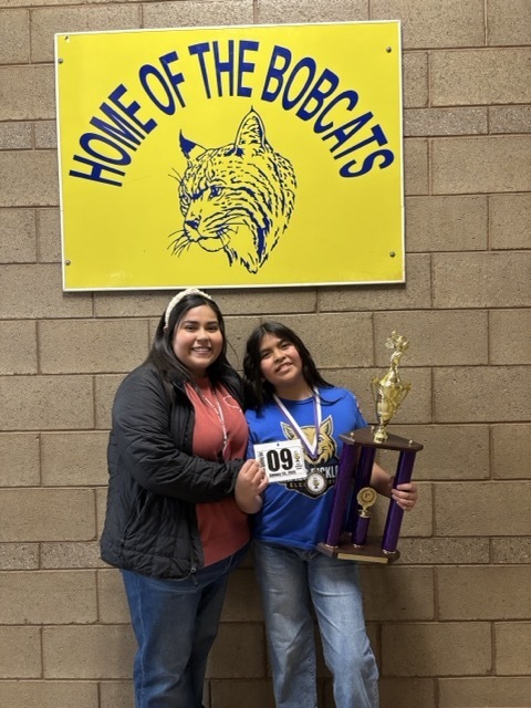 Camilla with a staff member