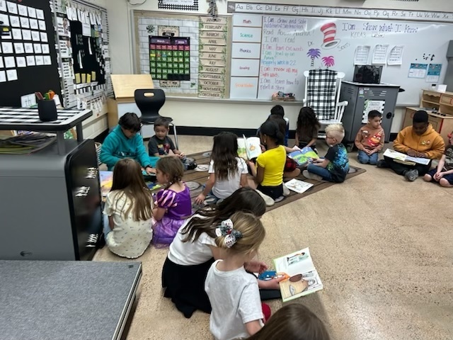 students reading aroudn the room