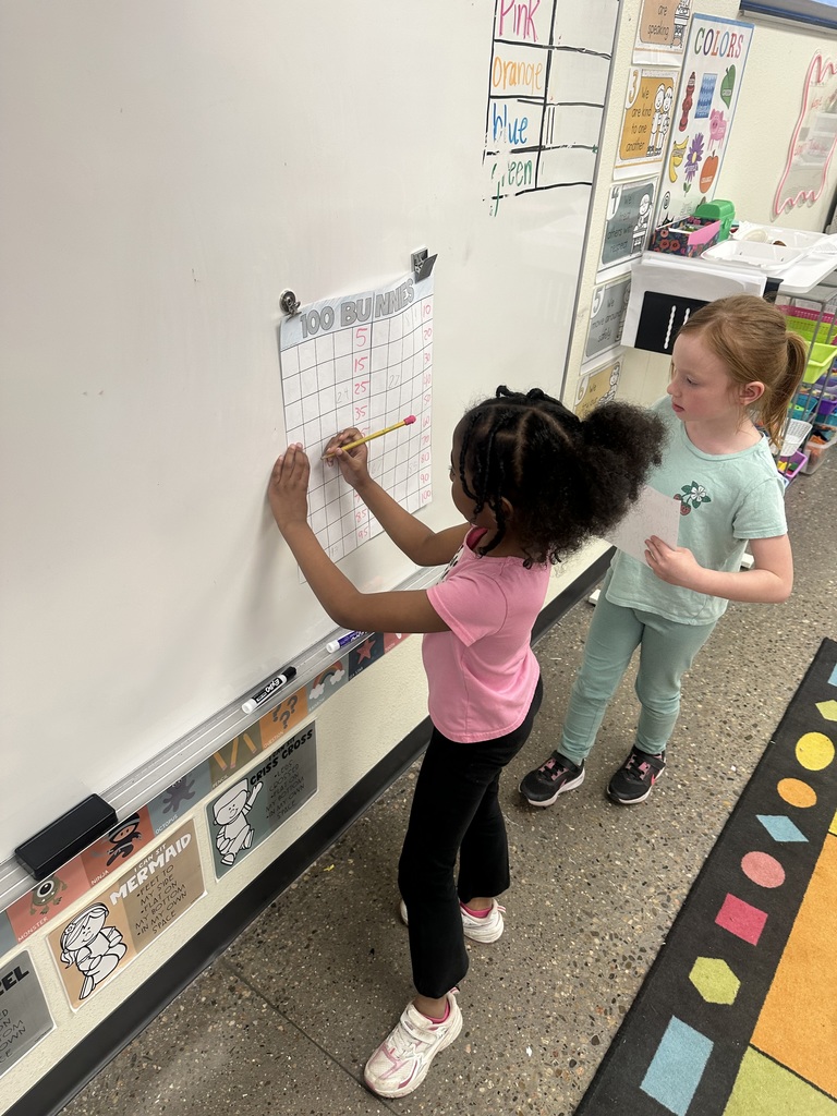 Mrs. Sullivan and Ms. Tapia's class Hunting numbered eggs for a 100's chart