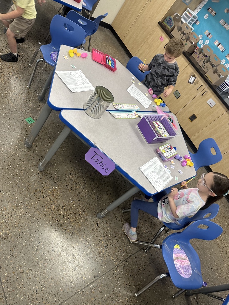 Mrs. Sullivan and Ms. Tapia's class Hunting numbered eggs for a 100's chart