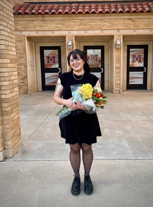 Mrs\. Cole with flowers