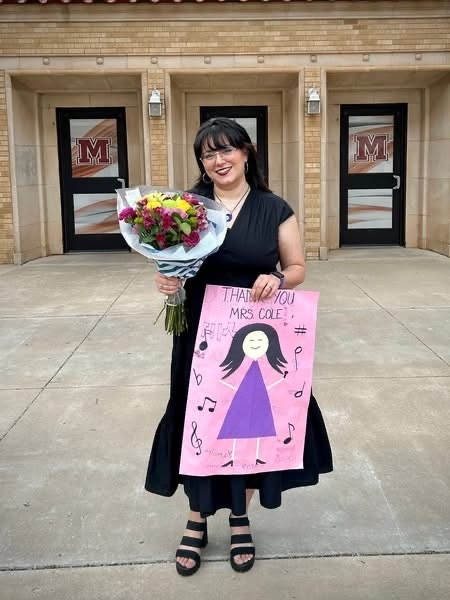 Mrs. Cole with her thank you card and flowers.