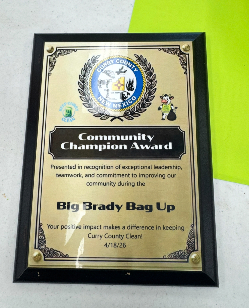 Plaque with "Community Champion Award" in gold. Award honors "Big Brady Bag Up." Dated April 18, 2026.
