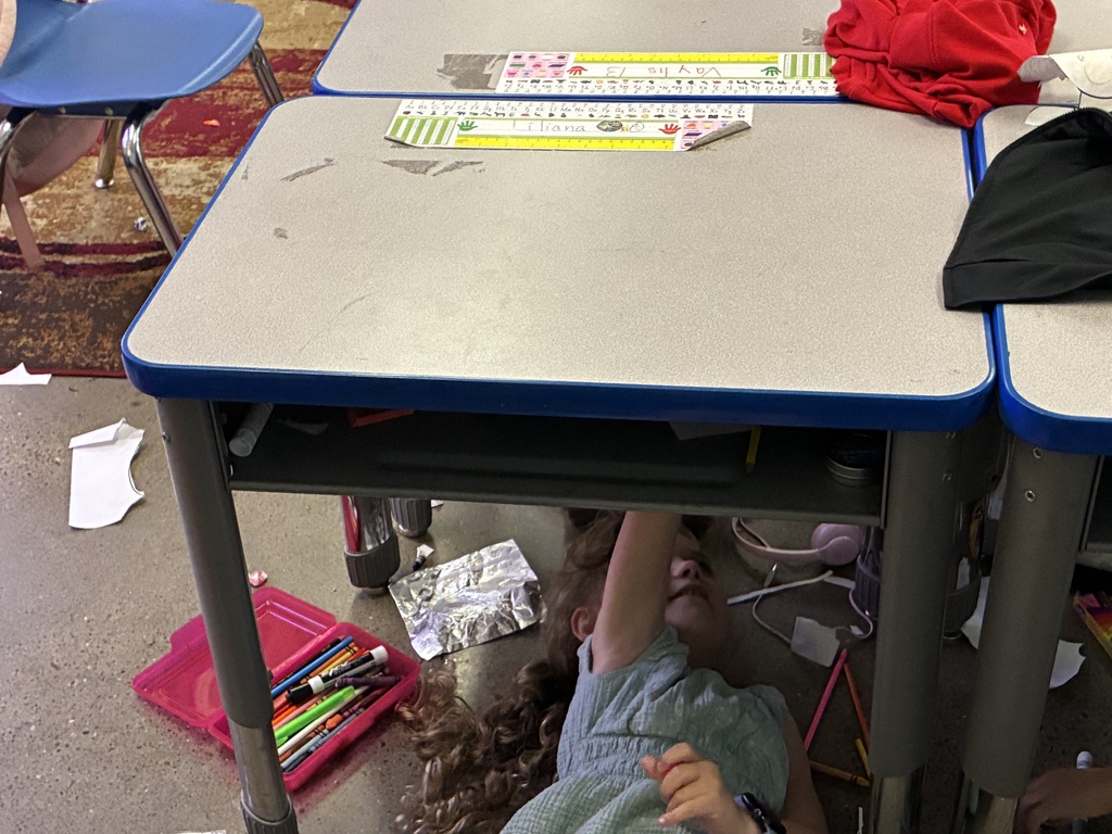 Mrs. Adams class creating art like MichelAngelo