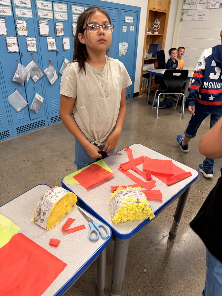 Spanish enrichment making Piñatas