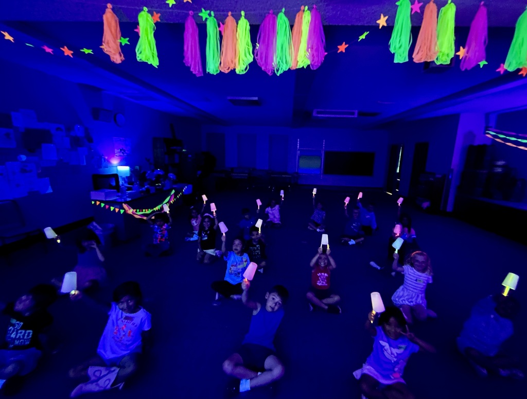 Students sitting in a glowing room