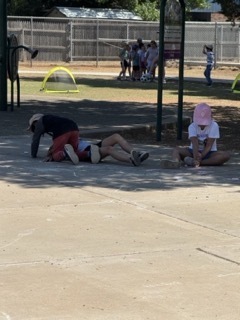 students resting during field day