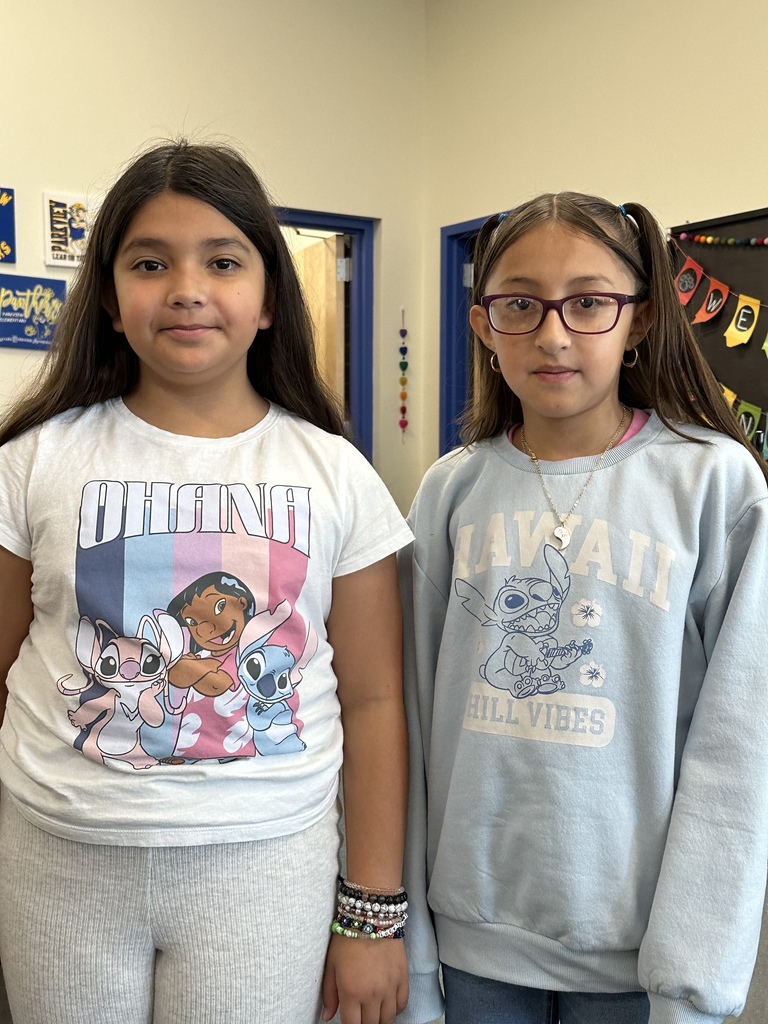 Two female students wearing clothing  for Stitch Day.