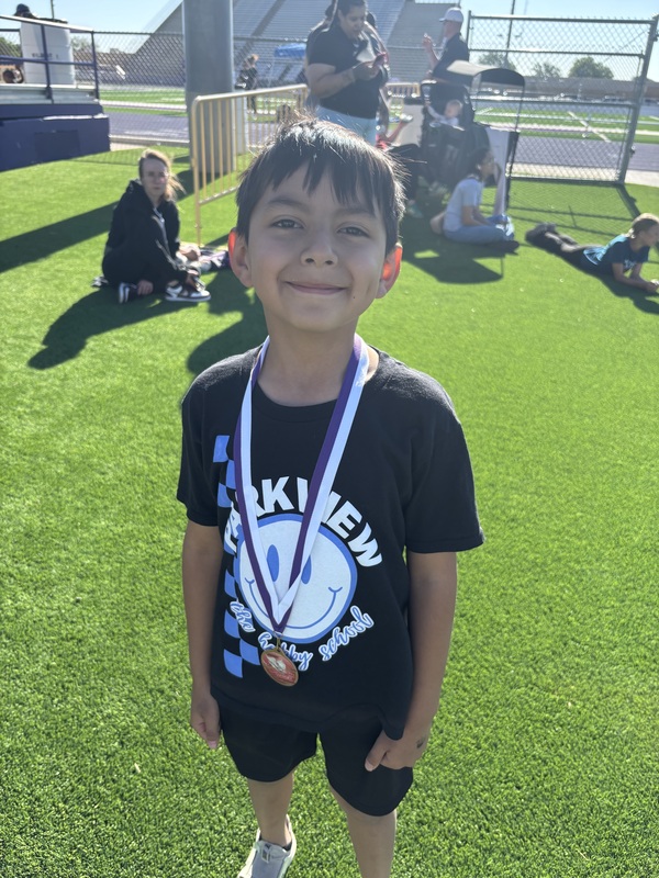 boy student wearing a medal