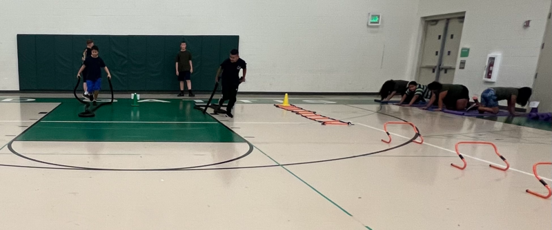 Gattis PE students completing a firefighter challenge