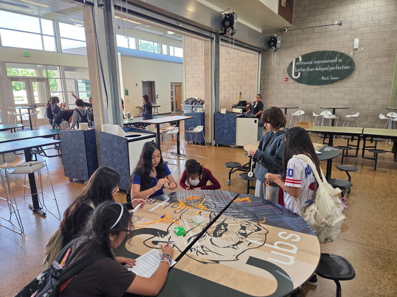 Students working on their paper chain/time management activity in CUB class.