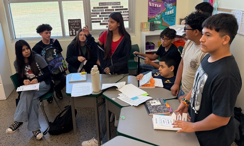 Students in Gwyn Del Toro's English class work together to answer questions during a football review game.