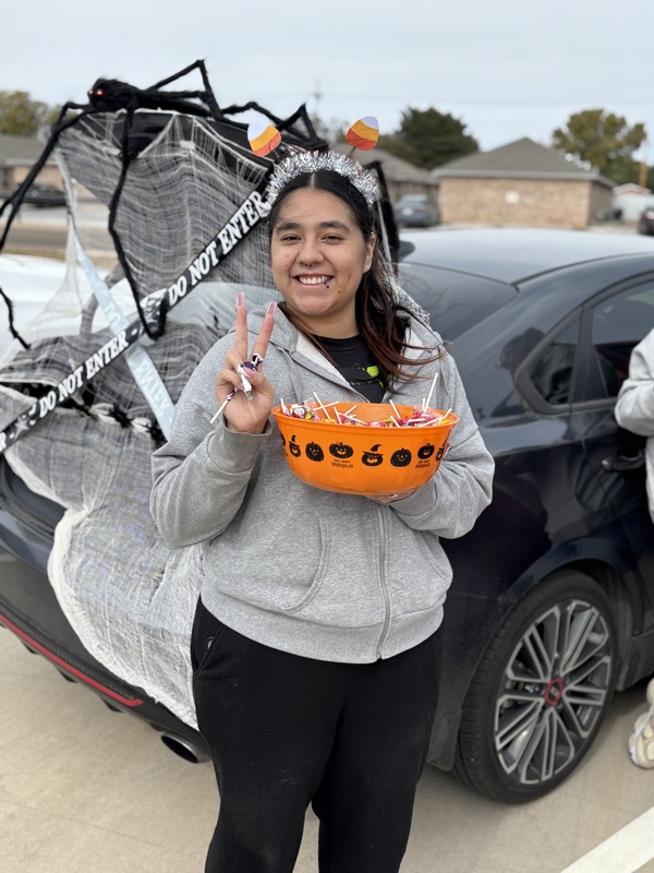 Girl holding bowl of candy