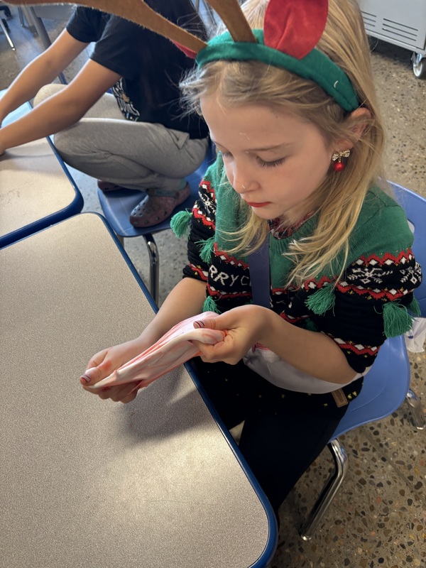 Student stretching slime