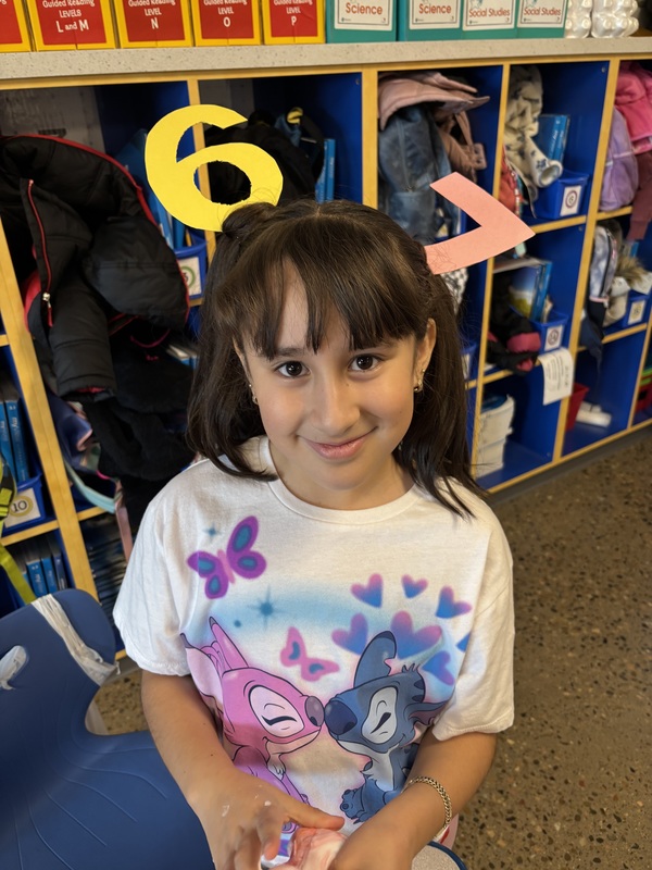 Student with silly "67" hair