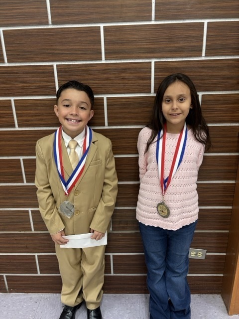 2 students with their awards