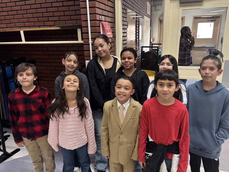 A group of boys and girls smiling