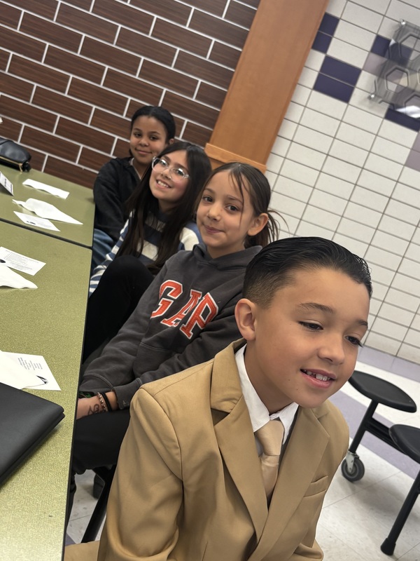 4 students sitting at a table