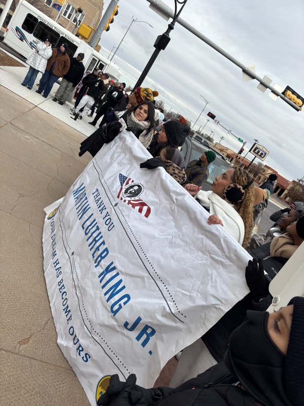 A group of people holding the Martin Luther King Jr. Banner