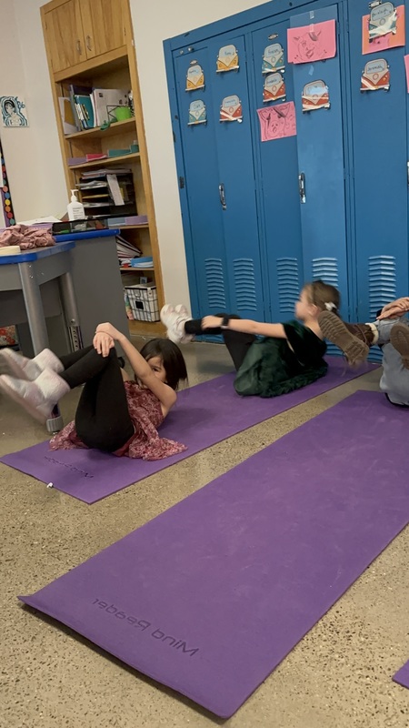 Pilates Enrichment doing ball rolls