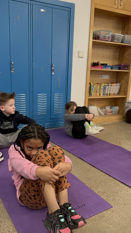 Pilates Enrichment doing ball rolls