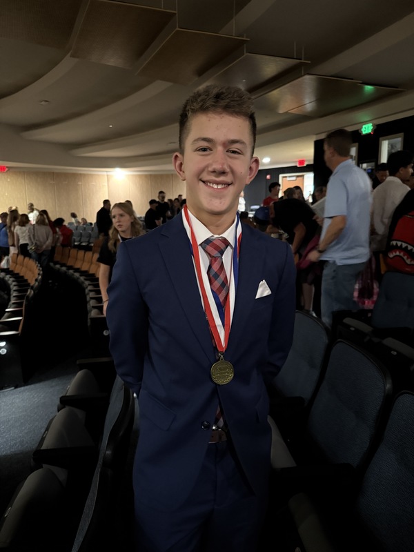 Grayson Boerio wearing a medal