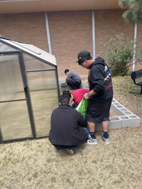 Students construct a greenhouse