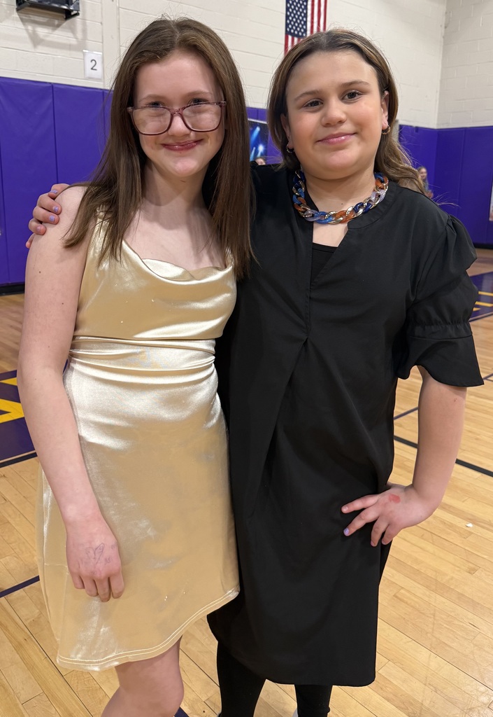 children pose at a school dance