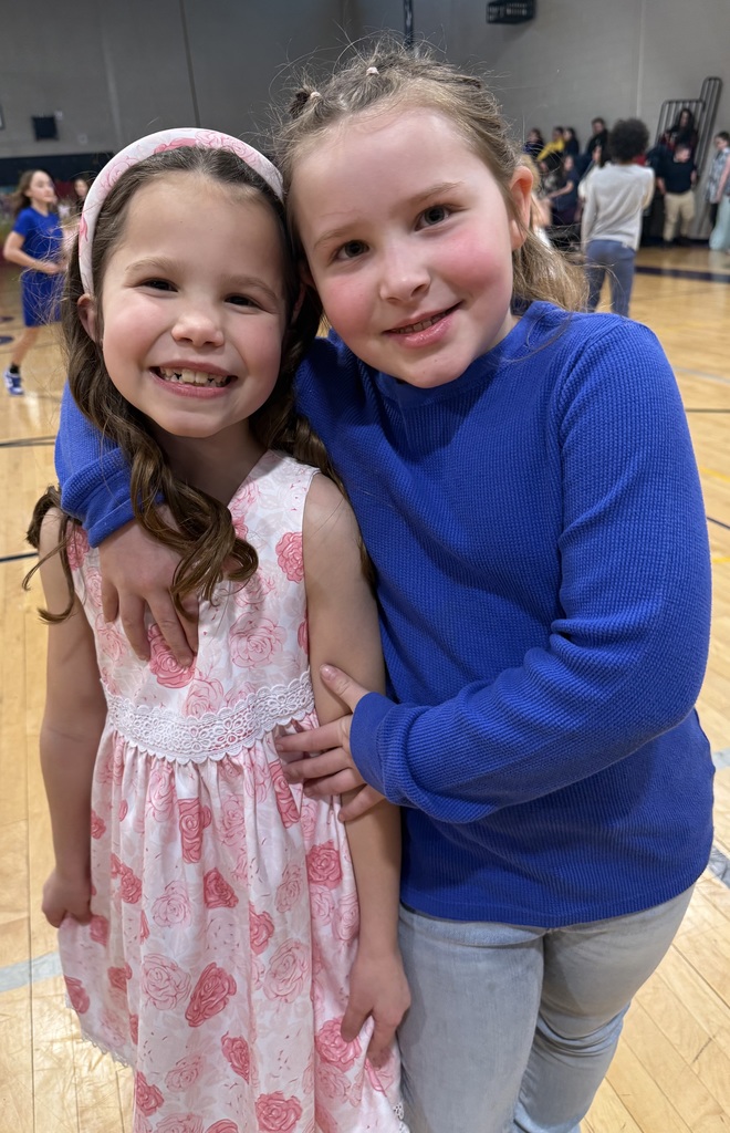 children pose at a school dance