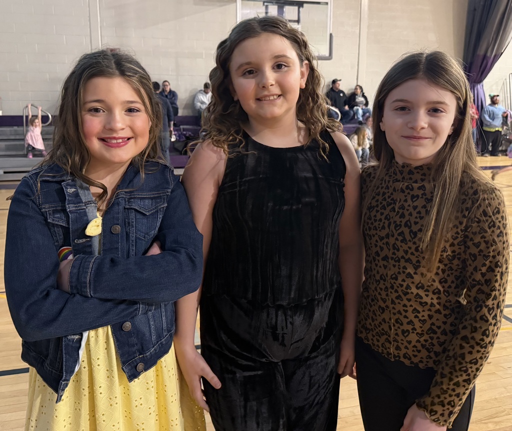 children pose at a school dance