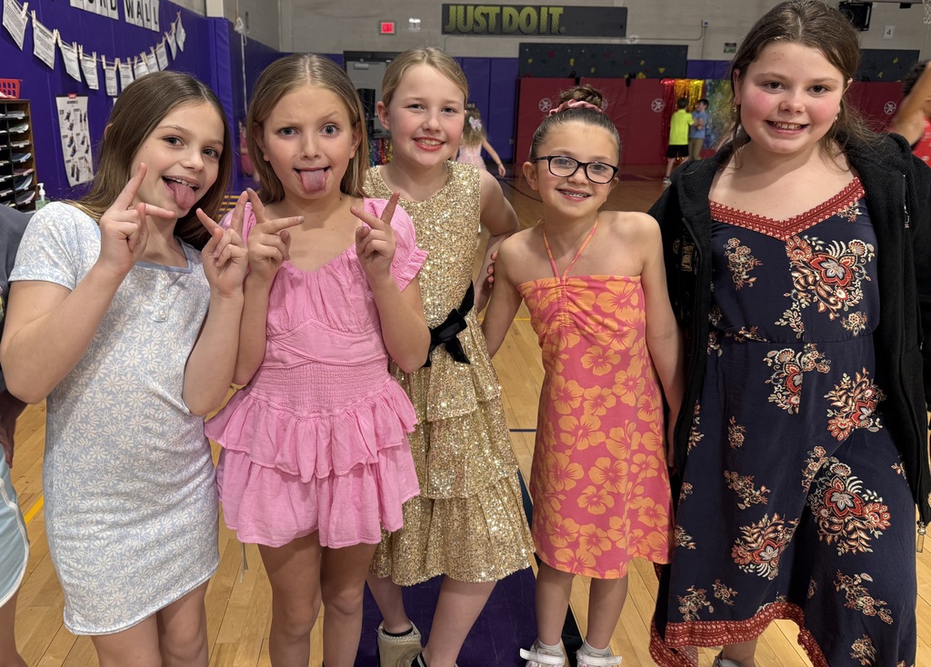 children pose at a school dance