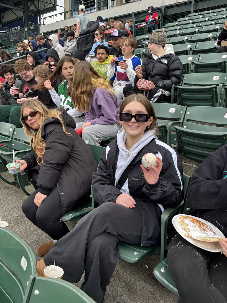 student shows off foul ball at pbis field trip to red wings game