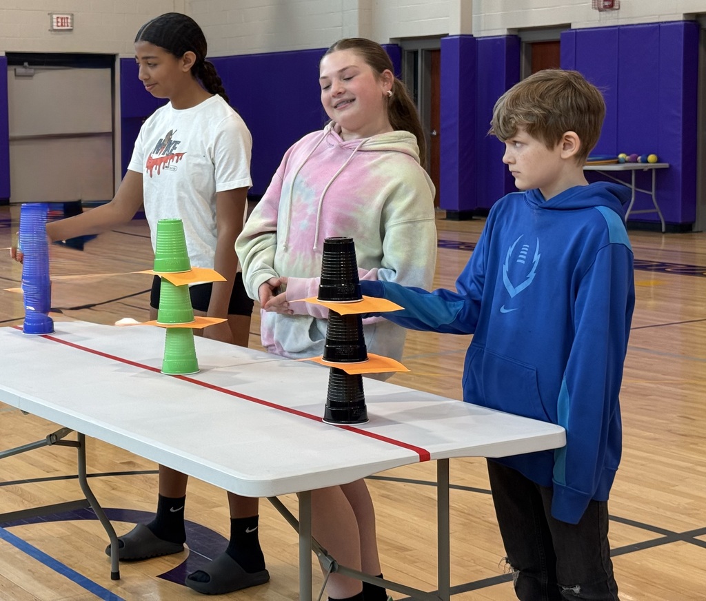 students doing games at an assembly